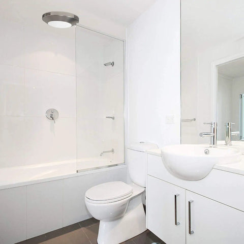Integrated LED Light Bath Fan With Ceiling Mount Exhaust Quiet One Point One Sones Eighty CFM Brushed Nickel Finish in bathroom