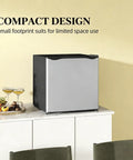 Compact Upright Freezer Silver 1.1 Cu Ft Countertop Mini Freezer on a countertop with fruit and drinks beside it.