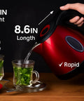 Red One Point Two Liter Cordless Electric Kettle 1500 Watt Fast Boil Stainless Steel pouring water into cups of tea on table.