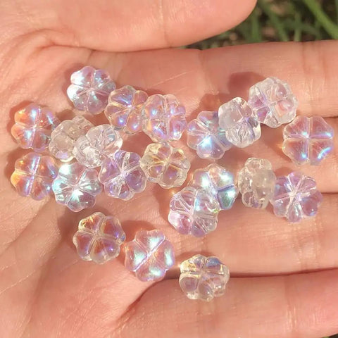Straight Up Killer Handmade Lampwork Crystal Flower Spacer Beads Flat Round Loose on a hand, showcasing colorful crystal glass.