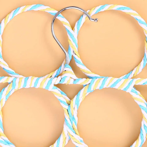 Close-up of Paper Rattan Scarf Hanger With 12 Foldable Rings For Wardrobe And Closet Organization featuring handwoven rings.