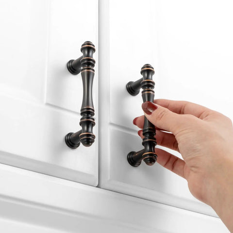 Premium 10 Pack 3 Inch Center To Center Oil Rubbed Bronze Cabinet Pulls featuring smooth rounded grip on white cabinets.