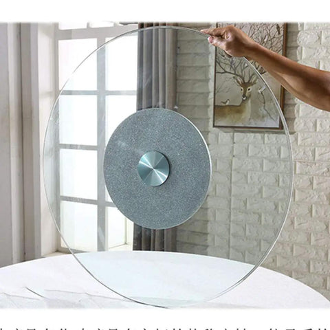 Adjustable Rotating Lazy Susan Turntable With Tempered Glass Top And Heavy Duty Aluminum Base Featuring Slick Rolling Bearings in hand.