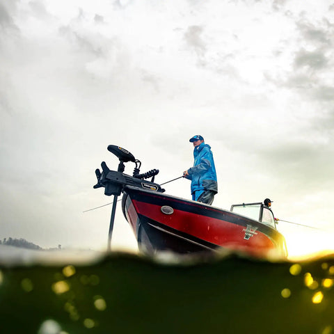 Dope Freshwater Bow Mount Electric Trolling Motor With GPS Spot Lock And Mega Down Imaging Packing 112 Pound Thrust On A 60 Inch Shaft For Hella Precise Dock And Drop Control with two fishermen in a boat.