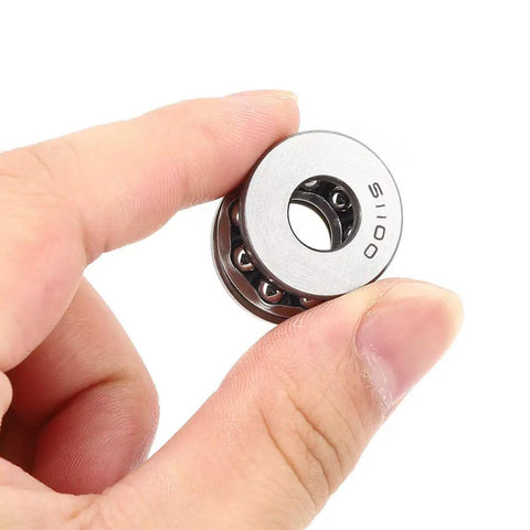Model 51100 Plane Axial Thrust Ball Bearing With Double Seals held in hand, showing steel construction for heavy duty machinery.