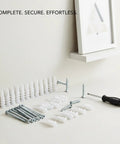 100 Pack Nylon Drywall Anchors With Screws For Hollow Walls laid out with screwdriver on white surface