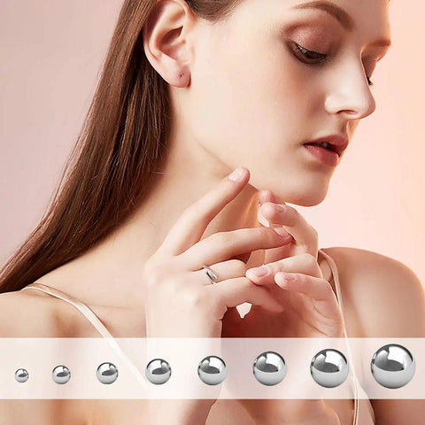 Top Shelf Stainless Steel Forging Balls Assortment For Custom Coin Ring Making Heavy Duty Tool Set displayed beside a model's hands.