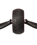 Killer Ab Rocker And Complete Core Toning Setup Featuring Rock Solid Ergonomic Handles Wide Non Slip Wheel With Heavy Duty Steel Coil. Close-up of ab roller wheel with textured grips.