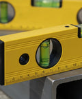 Spirit Level, Aluminum Alloy, 250mm close-up showing bubble level and measurement markings on a work surface.