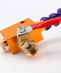 Close-up of brass nozzle and valve of the adjustable mist coolant sprayer for CNC machines and lathes.