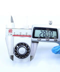 Kickass Heat Resistant Bearings 12X28X8Mm 500C Double Sealed Steel Balls measuring 28mm with digital caliper for precise sizing.