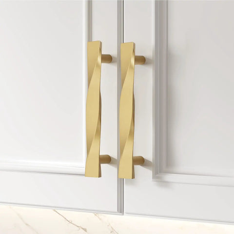 Premium Brushed Gold Cabinet Pulls 3 Inch Hole Center Heavy Duty Zinc Alloy Kitchen And Bath Door Handles Built Tough Durability 15 Pack close-up view on white cabinetry.