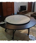 Top Tier Hardwood Lazy Susan Turntable Forty Five Inch Round Rotating Serving Tray For Kitchen And Dining with marble finish on a dark wood table.