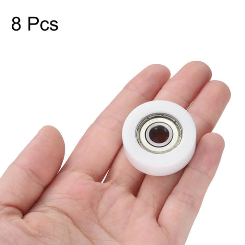 Eight Piece 608ZZ Double Shielded Nylon Ball Bearing Roller in hand, showcasing 32mm white nylon design for drawer slides.