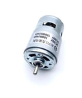 Plug And Play 775 Dc Motor Ball Bearing Build Wide Voltage Range Supporting Twelve Through Sixty Volts Twin Speed Settings Maxing Out At Twenty K Rpm close-up of metal body motor with shaft for garage projects.