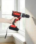Heavy Hitter Cordless Drill Set With Variable Speed Gears And 25 Plus 3 Torque Settings used for drilling into a wall.