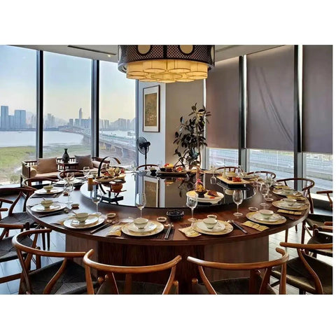 Heavy Duty Tempered Glass Lazy Susan Roller Tray Matte Black 31 Inch Round Dining Table Spinner set on a large dining table with dishes.