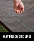 Hand securing Heavy Duty Weed Barrier Fabric 4 Ft By 50 Ft Durable Woven Ground Cover For Driveways, Garden Beds, And Landscaping