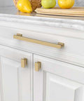 Ten Pack Champagne Bronze Cabinet Knobs Heavy Duty Drawer Pulls Rock Solid Kitchen Hardware Easy Peasy Install 7 Inch Center To Center top view of champagne bronze cabinet handles on white cabinets.