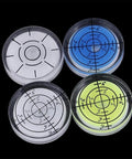 Round Bubble Level for Precision Measuring and Alignment Tasks, set of four levels in various colors, highlighting precision markings.