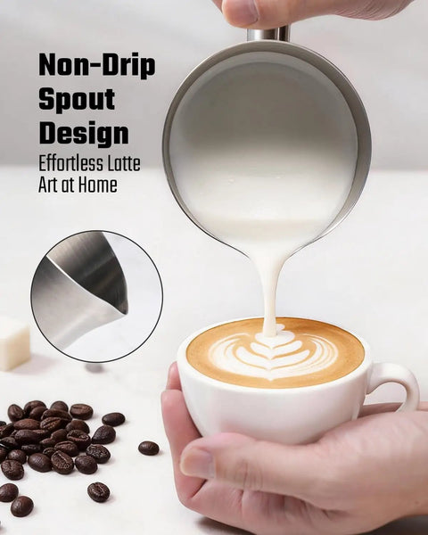Pouring milk from 5 In 1 Milk Frother And Steamer With Adjustable Temperature 17 Oz into coffee with latte art, stainless steel spout.
