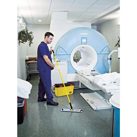 Professional Grade 58 Inch Yellow Quick Connect Straight Mop Handle For Industrial Janitorial Floors being used in a healthcare setting.