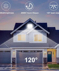 Dual Pack 100W LED Flood Lights with Plug, illuminating a house exterior with 12000 lumens bright daylight and 120° beam angle.