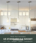 One Light Mini Pendant With White Frosted Shade, Brushed Nickel Finish over a modern kitchen island, sloped ceiling friendly.