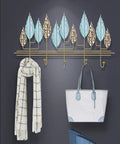 Rock Solid Wall Mounted Coat Rack With Heavy Duty Iron Hooks For Entryway And Mudroom Storage, showcasing bags and a scarf.