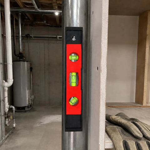 Spirit Level, New Yellow Level 23CM mounted on a steel pole, showing bright vials in a construction setting.