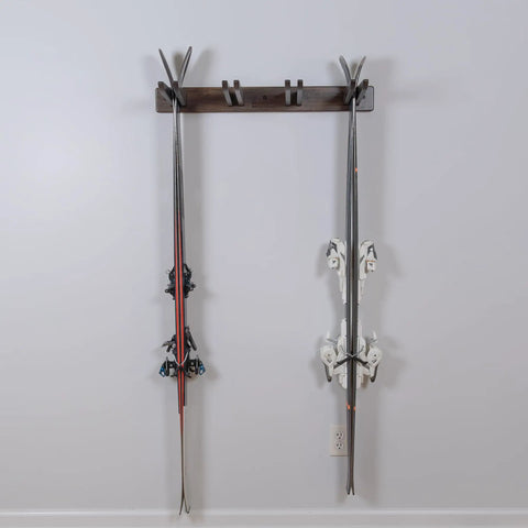 Hella Durable Solid Hardwood Ski And Snowboard Wall Rack Holds Four Pairs Smooth Espresso Finish with two skis mounted.