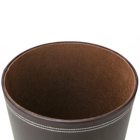 Classic Pu Leather Round Trash Can In Brown For Bathroom Powder Room Kitchen Office And Hotel Use Durable PU Exterior With Non Woven Liner And White Stitching Dope Modern Wastebasket For Home showing open interior view and white stitching detail.