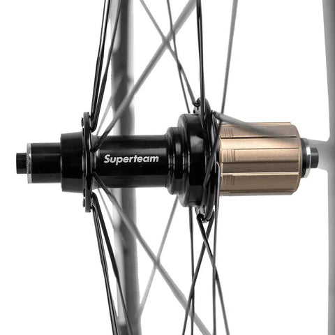 Rear hub detail of Dope Carbon Road Wheelset With Basalt Braking Surface, 38mm Rim Depth, 23mm Inner Width, 700c Clincher, Matte 3K Finish.