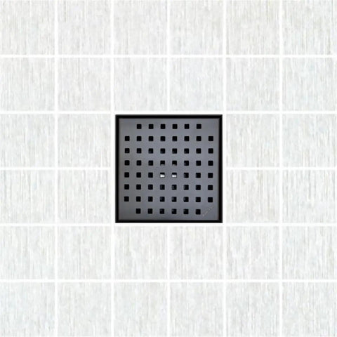 Premium 6 Inch Square Shower Drain With Slick Matte Black Polish And Heavy Duty 304 Stainless Steel Frame in a tiled bathroom.