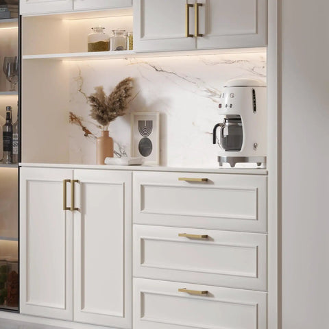 Top Shelf Champagne Bronze Cabinet Pulls 5 Inch 10 Pack Brushed Gold Drawer Handles on kitchen cabinetry with white finish.