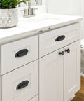 Drop Dead Gorgeous Matte Black Cabinet Pulls And Drawer Cup Handles Three Three Quarter Inch Five Pack on white bathroom cabinetry.