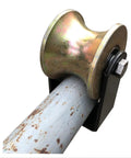 Beefy U-Shaped Steel Track Wheel With 3-Inch Wide Groove And 80-Millimeter Arc Guide Roller Bearing For Heavy Duty Sliding Gate Door Fence Rail Repair In Garage Or Industrial Settings Rock Solid Performance close-up view on metal rail.