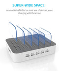 White five-port USB-A charging station with removable baffles for organizing multiple devices, keeps desk neat.