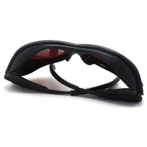Badass OD4 Plus Laser Safety Goggles, black frame, red lenses, side angle view, designed for heavy duty lab work and precision manufacturing.