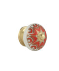 Vibrant red ceramic cabinet knob with intricate design and matte gold tone base. Part of Pack Of Twelve Handmade Ceramic Cabinet Knobs In Vibrant Red And Matte Gold Tone For Pull Handles On Kitchen Drawers Dressers And Wardrobes With A Killer Vibe That Truly Slaps.
