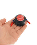 Low Key No Stress Automatic Aerosol Fire Extinguisher 2 Pack With Heavy Duty Back Adhesive Auto Extinguishing Patch in hand view.