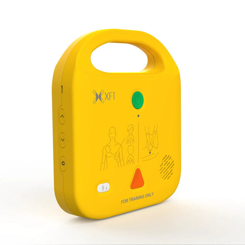 AED trainer device, yellow, front view showing XFT-120NB branding and green power button.