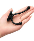 Heavy Duty Black Wall Mounted Coat Hooks 10 Pack With Complete Hardware Kit No Fuss Setup shown in hand for size reference.