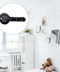Old School Key Shaped Wall Mounted Coat Hooks Rack In Durable Black Oak Wood For Entryways And Closets Decorative Hanging Organizer on white wall.