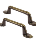 Set of two vintage style cabinet pulls featuring a warm antique bronze finish for furniture makeovers.