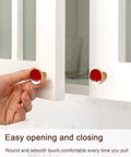 Top Tier Beech Wood Cabinet Knobs Round Drawer Pulls One Point Four Inch abstract red and white knobs on kitchen cupboard.
