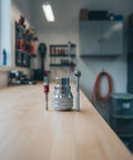 Badass 3/8 Inch Socket Bundle With Non Slip Adjustable Socket And Snappy Ratchet Plus Included Double Groove Extension Rod showcased on workbench.