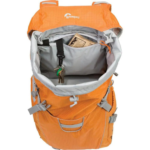 Ultra Cinch Camera Chamber Backpack for on the go photographers with padded secure gear compartment shown from top view open in bright orange