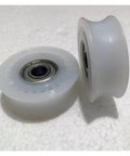 Silent Glide Sliding Glass Door Rollers With Zero Friction Flanged Wheels And Rock Solid Nylon Hanging Track Hardware Kit visible, white nylon wheels detail.
