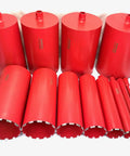 Diamond core bits set with various sizes in red, used with Straight Shooting Heavy Duty Workhorse Diamond Coring Drill.